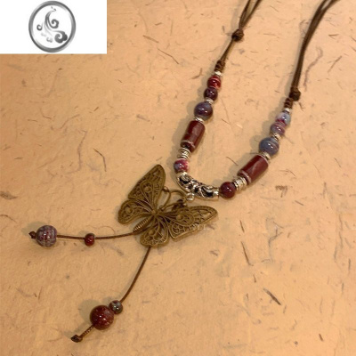 JiMi复古民族风陶瓷蝴蝶铃铛吊坠项链女2023年新款潮长款毛衣链配饰品