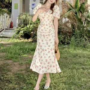 法式碎花连衣裙女夏季新款设计感露背系带收腰显瘦短袖茶歇中长裙